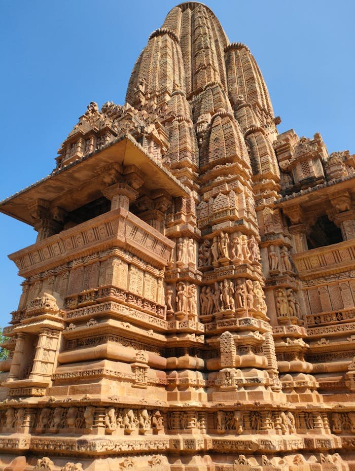 Exquisite ancient architecture of Khajuraho temple, showcasing intricate carvings and historical significance.
