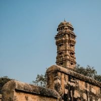 Vijay Stambh, a majestic Victory Tower in Chittorgarh, India, under a clear blue sky.